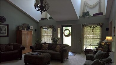 Living room with cathedral ceiling and dormers tha
