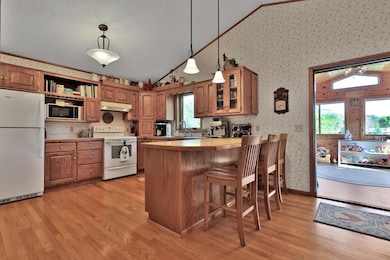 Eat up peninsula Kitchen window at the sink to enjoy the back yard.