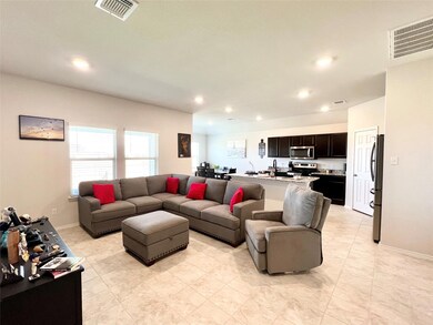 Living area featuring recessed lighting and baseboards