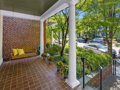 Full width front porch framed in natural beauty
