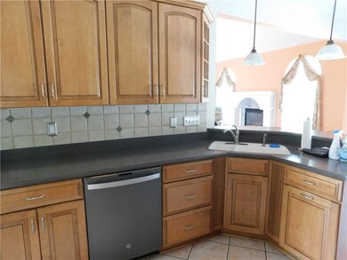 Backsplash, dishwasher, garbage disposal, and doub