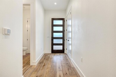 Entrance foyer featuring light wood-style floors 