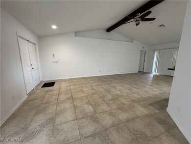 Empty room featuring a ceiling fan, visible vents,