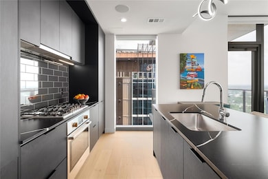 Kitchen with a sink, appliances with stainless st