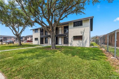 Townhome / multi-family property featuring brick siding and a balcony