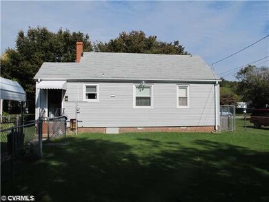Exterior Front - Back of house with fenced yard , 