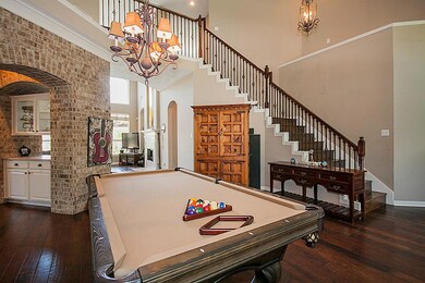 View of entry way from the front door. Wine Grotto inside the brick arch way.