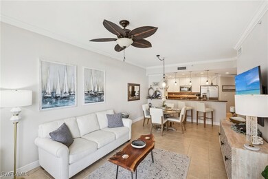 Tiled living room featuring ceiling fan and orname
