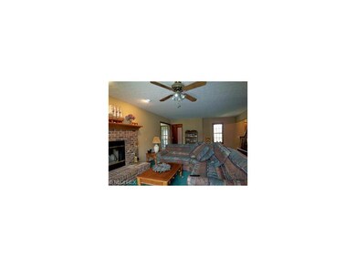 Spacious Family Room showing the Brick Fireplace!