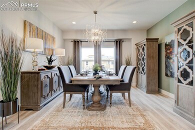 Dining space featuring light wood-style floors, a chandelier, and recessed lighting