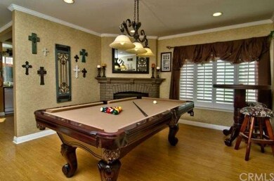 DEN USED FOR POOL TABLE -- SEE FIREPLACE AND PLANT