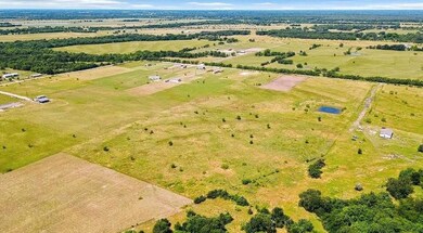 Birds eye view of property with a rural view