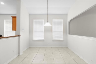 Unfurnished dining area with light tile patterned flooring