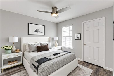 Bedroom featuring dark wood-style flooring and ce