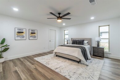 Bedroom with hardwood / wood-style floors and ceil
