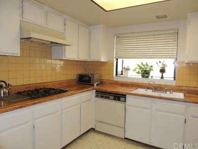 Kitchen with newer tile back splash, water purifie