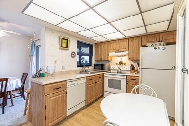Kitchen with sink, light hardwood / wood-style flo