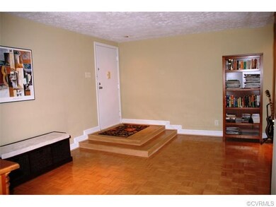 Raised foyer with wood parquet floor