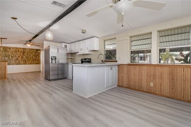 Kitchen with wood walls, stainless steel appliance