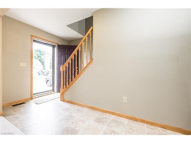 Greet your guests in this Foyer open to the Great 