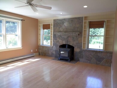 Living Room/wood stove does not convey