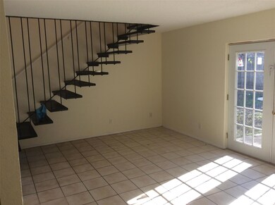 Empty room with light tile patterned floors and s