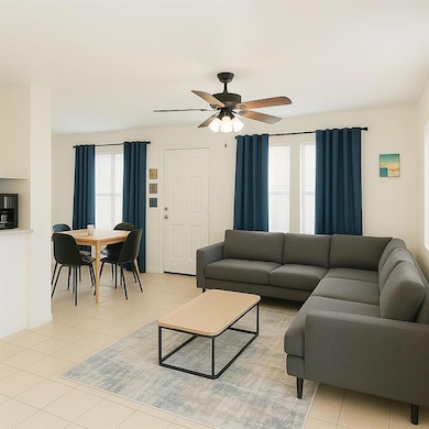 Living room featuring light tile patterned floors