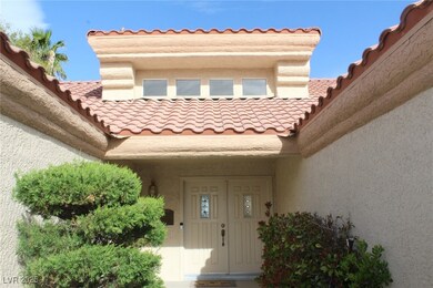 Doorway to property featuring stucco siding and a