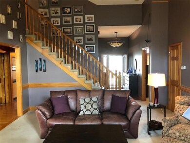 Soaring Ceilings in Great Room. View from Gas Fire