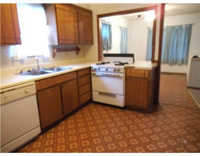 Cafeteria/Kitchen. Kitchen opens to Dining Room
