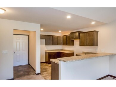 Kitchen view with raised breakfast bar.