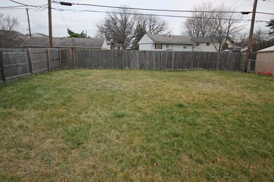 Level, fenced back yard