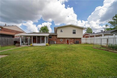 Fabulous FLAT FENCED back yard with great sun room