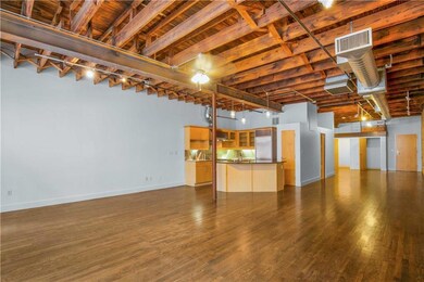 Unfurnished living room featuring a sink, visible