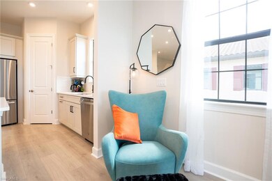 Sitting room featuring light wood finished floors and recessed lighting