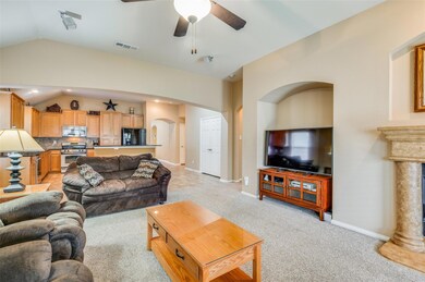 Living room featuring light carpet, vaulted ceilin
