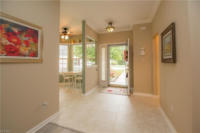 Spacious entry way with ceramic flooring.