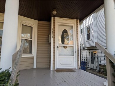 The front porch offers a small sitting area.