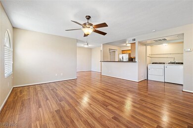 Unfurnished living room featuring ceiling fan, was