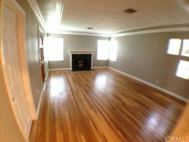 Wide view of the living room with door to the 1/2 