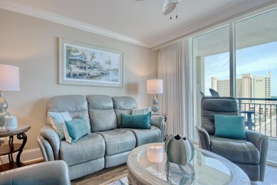 Living area featuring crown molding, a ceiling fan, baseboards, wood finished floors, and a view of city