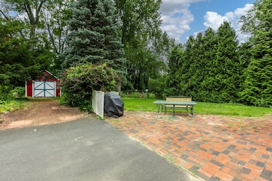 Brick Patio and Paver driveway to garage