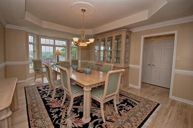 DINING ROOM - Elegant dining space with wide moldi