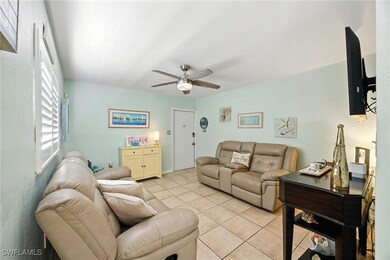 Living area featuring light tile patterned floors