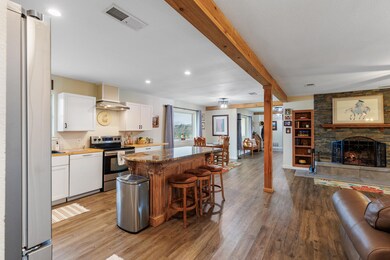 Kitchen featuring stainless steel appliances, ope