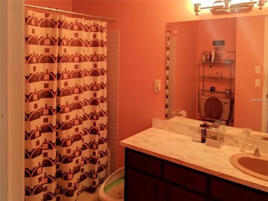 The guest bathroom has a single sink with extended