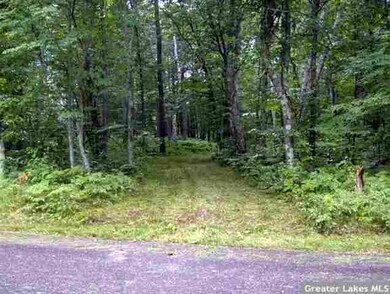Driveway entrance on east send of lot