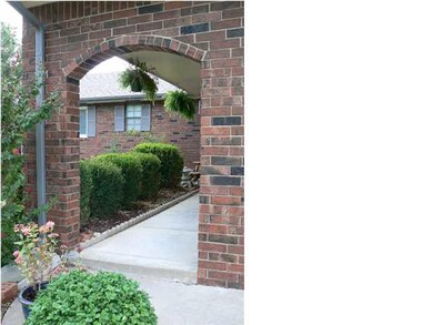 Pretty brick front arch greets all your guests.