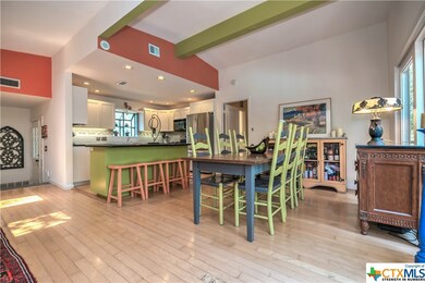 Dining area open to kitchen and living.