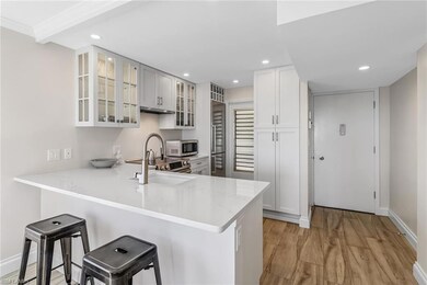 Kitchen featuring stainless steel microwave, a sin